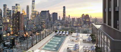 rooftop pool and loungers with NYC buildings to horizon